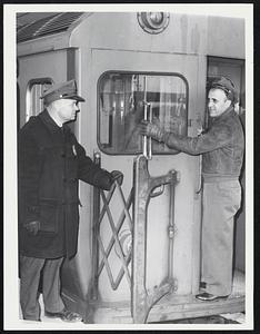 Cleaning Windshield is Motorman Chalres Cabral of Som. Inspector Louis F. Shaw of Som. 1st train to leave Everett Station at 2:44 PM for Forest Hill.