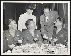 Greater Boston Boys of Americal Division, on furlough after the Southwest Pacific, were feted at a dinner and entertainment given by Mayor and Mrs. Tobin at the Hotel Statler. In front, left to right, PFC Francis Micheau of Brockton, Sgt. William J. Briere of Somerville and Staff Sgt. Winthrop P. Wells.