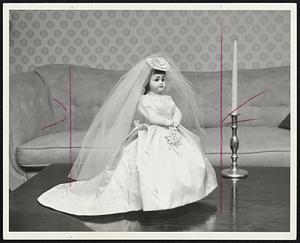 Here Comes the Bride a 70-year old bisque doll dressed in scaled replica of a $1,200 gown by Priscilla of Boston.