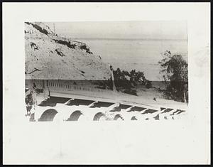 Riverside drive viaduct in Los Angeles as it is being demolished by a landslide that is taking everything with it. About $200,000 damage was done here.