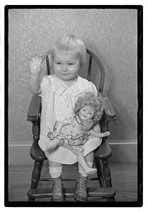 A girl holding a doll