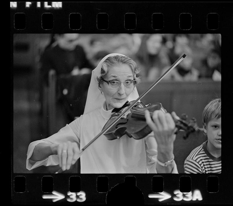 Nun plays violin, Boston