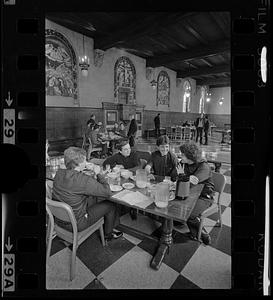 Student priests in seminary dining room, Brighton