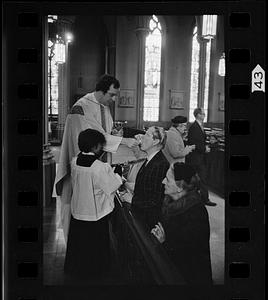 Taking communion at mass in Southie, Boston