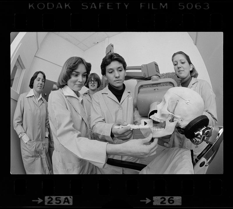 Dental students practice x-ray film placement using dummy, Boston