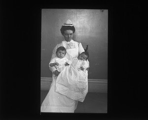 Woman Holding Two Infants