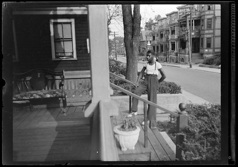 A man poses on stairs