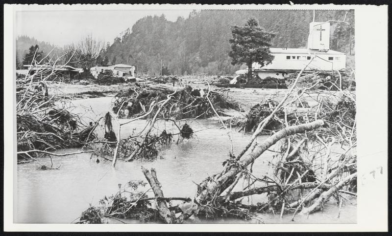 The West's big floods devastated most buildings in Klamath, Calif., but the church (above), standing on slightly higher ground, survived the destruction. Business district was destroyed and most of residential area is gone.