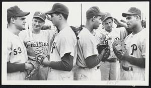 Confusing, to say the least. And it's no wonder when two sets of twins show up at the Philadelphia Phillies' rookie school at Clearwater, Fla. Left, Coach Ken Silvestri scratches his pate as he tries to figure the Casteens. Well, that's Russ on the left and the other is Dan. The fact both are outfielders doesn't help the matter any. Right, Coach Charlie Gassaway is equally confused as he confronts the Haines brothers. That's infielder Rob on the left and Richie, and outfielder, on the right.