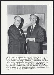 Mayor Kevin Hagan White accepting for the Boston area, Honorary State Chairmanship from Frank Le Roy Johnson, Director of the Parkinson Research Foundation of Massachusetts, which has no salaried officials, and whose "Function" is to raise funds and award grants to Massachusetts hospitals doing research in Parkinsonism.