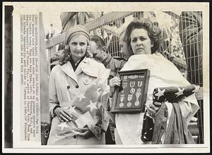 Gold Star Mothers at Protest -- Two Gold Star mothers hold their dead sons' medals at an antiwar protest near the Capitol today. They are Anna Pine, left, of Trenton, N.J., and Evelyn Carrasquillo of Miami, Fla., a native of Puerto Rico. Fred Pine and Alberto Carrasquillo were killed in Vietnam in 1968.