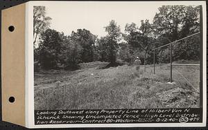 Contract No. 80, High Level Distribution Reservoir, Weston, looking southwest along property line of Hilbert Van N. Schenck showing uncompleted fence, high level distribution reservoir, Weston, Mass., Aug. 12, 1940