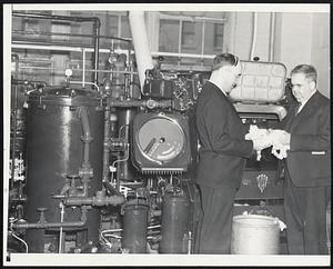 Machine Vs. Hands-At left: Wool sample testing apparatus demonstrated today at appraisers' stores. Right: John J. Lenehan and James Kelley, expert testers, employed for years in sample testing by hand.