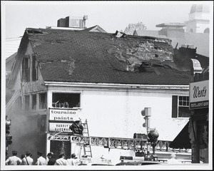 Detail of Harvey's Hardware, corner of Chestnut and Great Plain Avenue, during fire of May 22, 1977