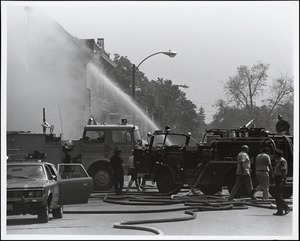 View looking down Chestnut Street of Newton and Needham fire departments helping out at the Needham Square fire of May 22, 1977