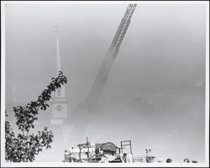 Looking towards Unitarian Church in Needham Square during big fire of May 22, 1977