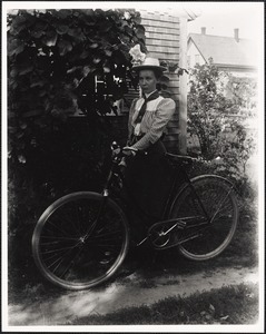 Portrait, young woman with bicycle