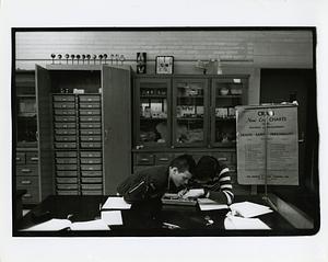 Two students dissecting a frog