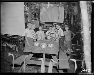 Group of children around a picnic table