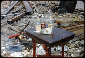Empty bottles on table in debris, West End, Boston