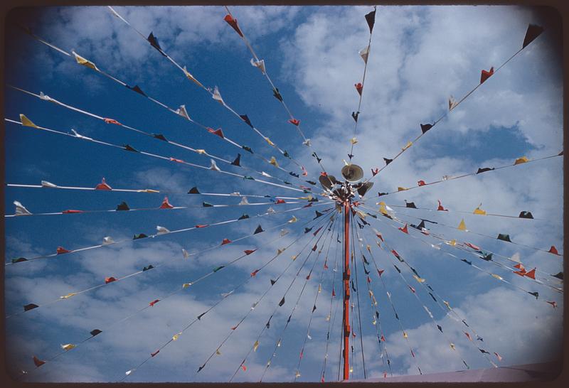 View looking up at pole with radiating lines of pennants, Boston