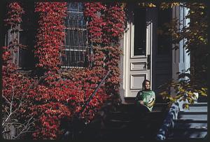 Woman sitting on the stoop of a brownstone in the South End