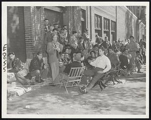 Faithful Followers of Fenway Flock settle back to listen to big game on portable radios after establishing beachhead on Jersey street in anticipation of Red Sox victory over New York Yankees in season finale and a World Series ticket sale in Boston that never materialized.