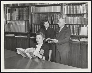 Jewish Library--Which will be opened Sunday at 3 P.M., adjacent to chapel of the Associated Synagogues of Greater Boston, 161 Devonshire street. Seated, Thelma Small of Malden. Standing, Mrs. Doris Small Cohen of Malden and Julius Meyer of Boston, a director of the association.