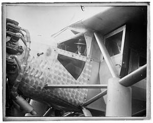 Charle Lindbergh seated inside his airplane, "Spirit of St. Louis"