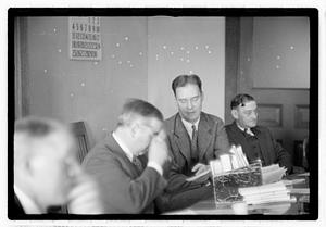 Group of men at table