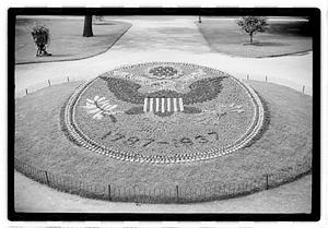 "1787-1937" floral design of the Great Seal of the United States in front of Ether Monument, Public Garden
