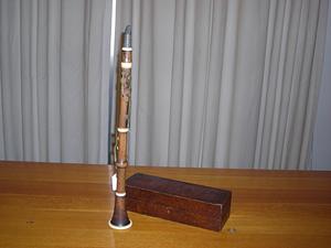 Wooden clarinet and a dark wood case