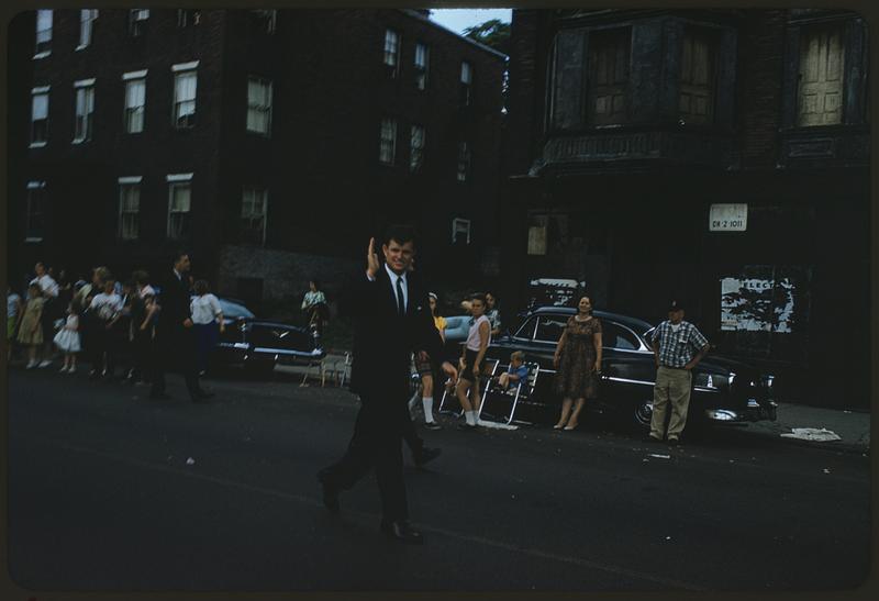 Man waving in Bunker Hill Day parade, Charlestown, Boston