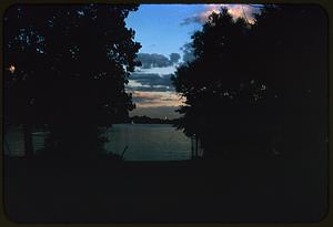 Sunset or sunrise over water, likely Boston