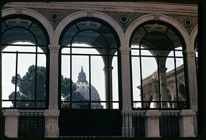 View through arcade windows of dome of St. Peter's Basilica, Vatican City