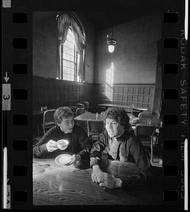 Student priests in seminary dining room, Brighton