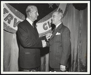 Honored - Herbert C. Ackerman, right, wholesale supervisor, Boston district, Replacement Tire Sales division, B.F. Goodrich Company, receives 30-year pin from John L. Collyer, company president, at recent ceremony at Akron, Ohio.