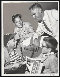 Hotel Meeting finds Manager Eugene (Jeep) Coyle of Newton discussing plans for today’s game against Levittown in Little League playoffs in New York with three of his players. Left to right, Mike Murphy, Joe Sonia, Coyle and Harold Mullin.