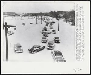 New York - Snowbound On The Parkway - Stalled autos and deep drifts halt all traffic on the Grand Central Parkway in borough of Queens on Long Island here today. Many drivers abandoned their autos stalling all traffic and blocking the efforts of highway workers to clear snow from the roadway. The storm was the worst in many years and automobile traffic was paralyzed.