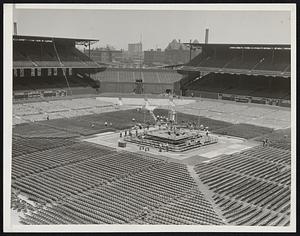 Fight Arena Takes Shape on Eve of Battle Chicago. Photo shows a general view of the elastic ring side seats at Comiskey Park where Jim Braddock will defend his heavyweight title against Joe Louis tomorrow night.
