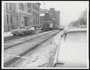 Snow scene in downtown Lawrence at noon Nov. 12.
