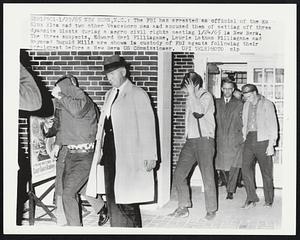 The FBI has arrested an official of the Ku Klux Klan and two other Vanceboro men and accused them of setting off three dynamite blasts during a negro civil rights meeting 1/24/65 in New Bern. The three suspects are shown in custody of FBI agents following their arraigment before a New Bern US Commissioner.