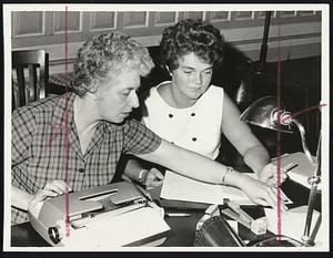 New Bedford teachers, Mrs. Lucille Lagasse and Nancy Walsh, volunteer to record additions to contract at negotiations yesterday.