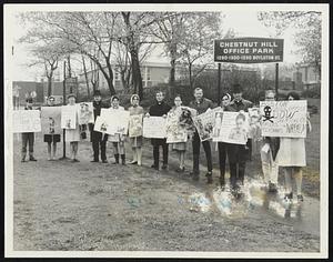 Picketing to Protest manufacture of Napalm by Dow Chemical were these members of the Massachusetts Catholic Peace Committee outside Dow offices at Chestnut Hill, yesterday.