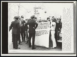 London – Students from the American School in London who were taking part in a march today protesting against the shooting of four Ohio students and the “increasingly brutal methods being employed in America to stifle opposition to Government policies and to crush dissent”, are halted outside the United States Embassy in Grosvenor Square. Four of the students were allowed to hand in two petitions at the Embassy.