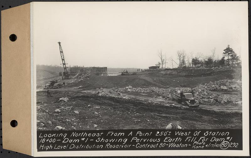 Contract No. 80, High Level Distribution Reservoir, Weston, looking northeast from a point 250 feet+/- west of Sta. 18+00, dam 1, showing pervious earth fill for dam 1, high level distribution reservoir, Weston, Mass., Apr. 17, 1940