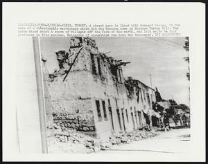 A street here is lined with damaged houses, in the wake of a catastrophic earthquake which hit the Erzurum area of Eastern Turkey 8/19. The quake wiped about a score of villages off the face of the earth, and laid waste to four provinces in five minutes. Estimates of casualties ran into the thousands.