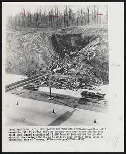 Rock But They Still Roll-Automobiles still manage to roll by on the New York Thruway near here today despite rock slide that dumped approximately 1,000 tons of rock across the greater width of the roadway. Debris up to 20 feet deep covered three lanes on southbound side of Thruway.