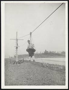 The breeches buoy in operation can he put up quickly anywhere