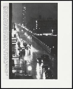 Two O'clock Darkness--This was the scene looking east on Pacific Street in Dallas today during blinding rain, and as hail the size of golf balls struck the downtown area at 2pm. Clouds were so thick and black that motorists turned in their headlights and city street lights were switched on.